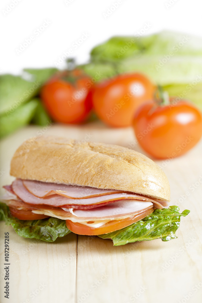 ham sandwich with blurred tomato background ham sandwich with blurred tomato background