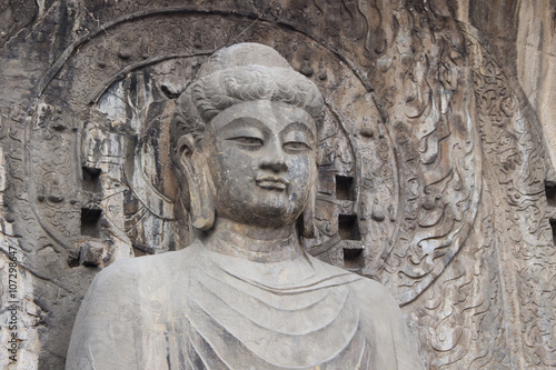 Budha's statue at Longmen Grottoes, Luoyang, Henan, China © grafixme