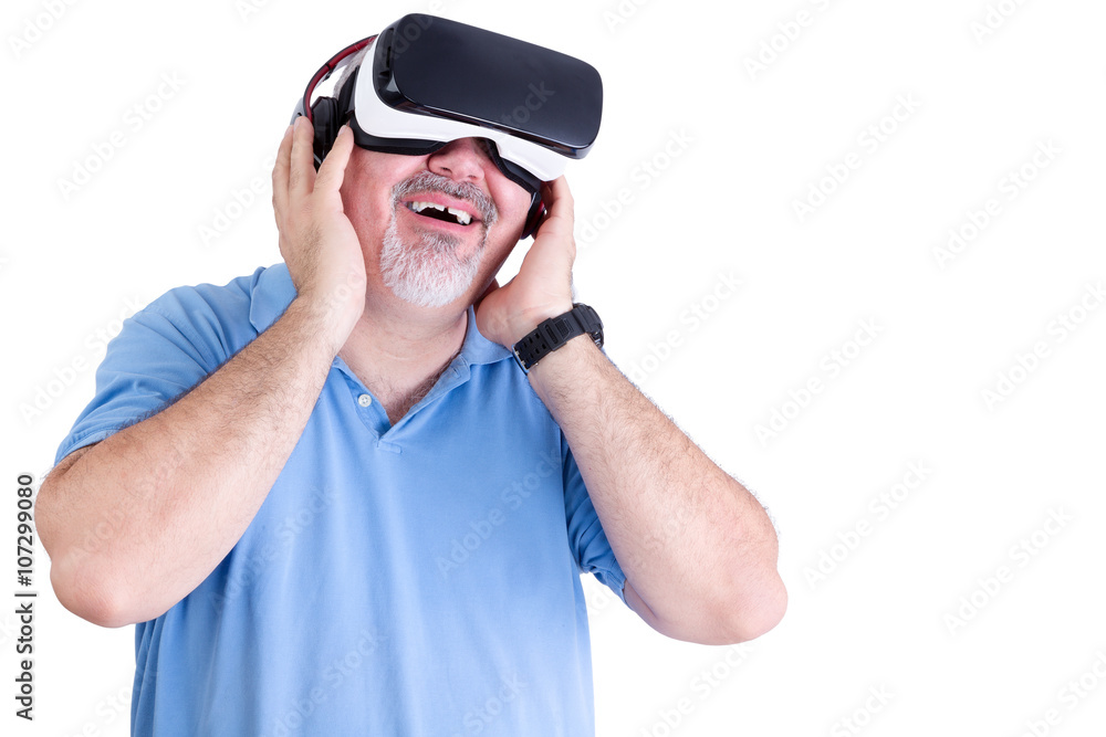 Smiling man holds virtual reality glasses to face Smiling man holds virtual reality glasses to face