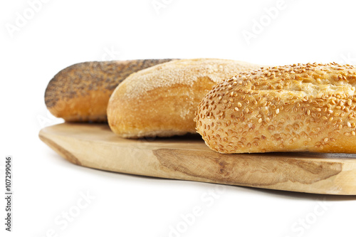 cropped image of breads on the wooden plank