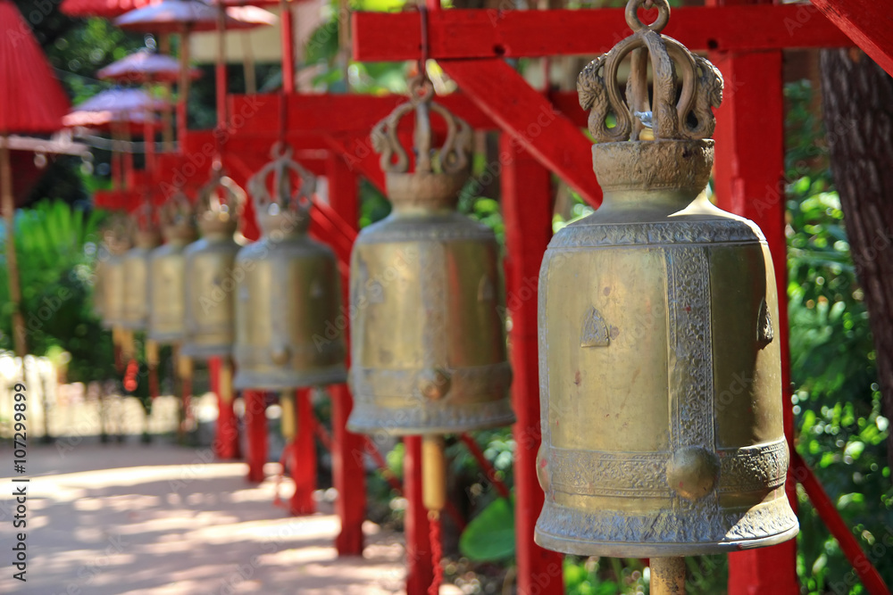 Fototapeta premium antique bells in a buddhist temple of Thailand