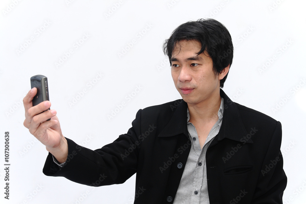 Businessman holding a cell phone for communication Businessman holding a cell phone for communication