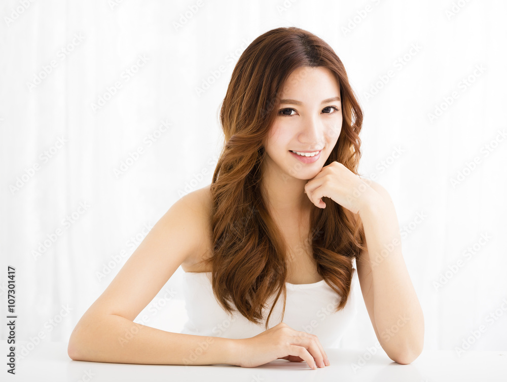 Closeup portrait of attractive young woman smiling Closeup portrait of attractive young woman smiling