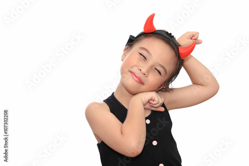 Scary cute little asian girl in black Halloween costume