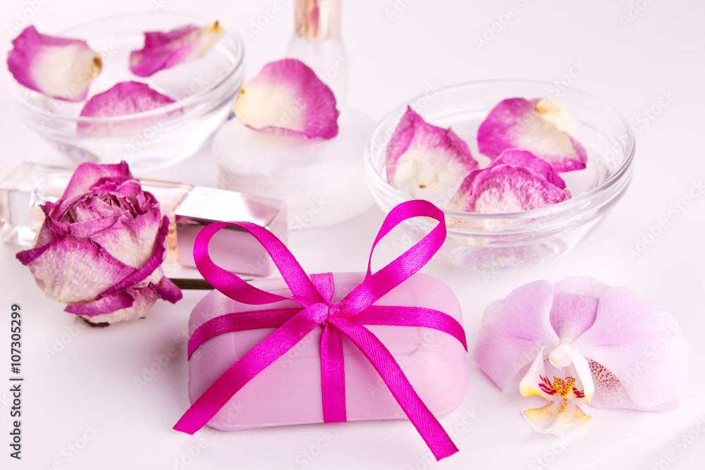 Soap with pink roses and candles for spa therapy Soap with pink roses and candles for spa therapy