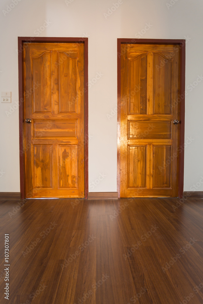 Fototapeta premium empty room, white mortar wall background and wood laminate floor