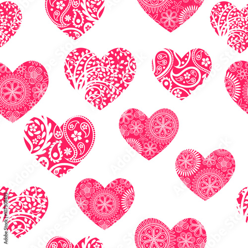 Seamless background with white patterns on pink hearts