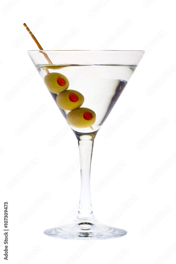 elegant martini glass with green olive and toothpick isolated on white