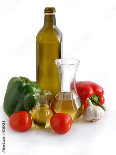 bottle of oil ,vegetables and vegetable salad