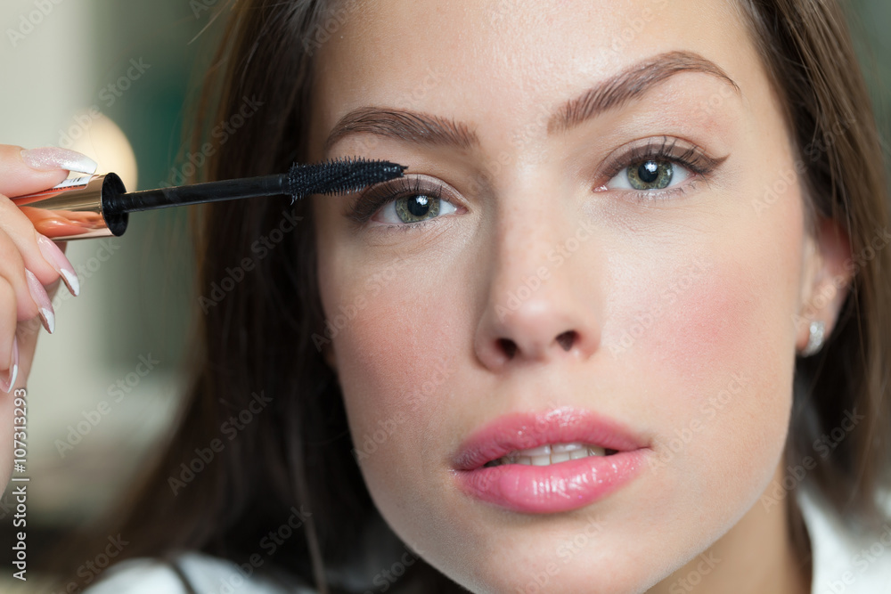 Woman wearing make up Woman wearing make up
