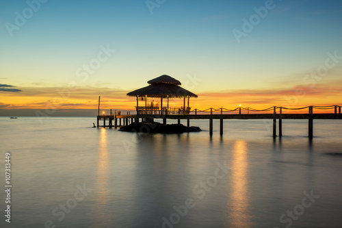 Summer  Travel  Vacation and Holiday concept - Wooden pier betwe