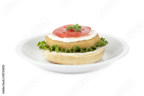 a plate with uncover chicken hamburger