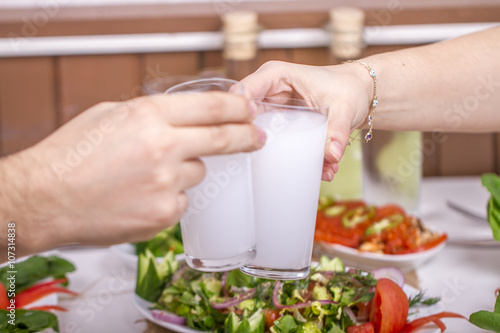  Preview
Save to a lightbox
 Find Similar Images  Share
Stock Photo:
Lovely Couple Sitting, Drinking, Say Cheers and drinking Turkish Traditional Drink Raki, Ouzo