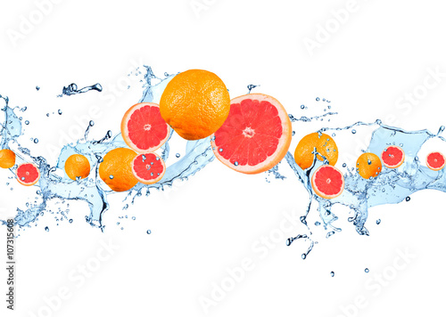 Fresh fruit in water splash, falling grapefruit