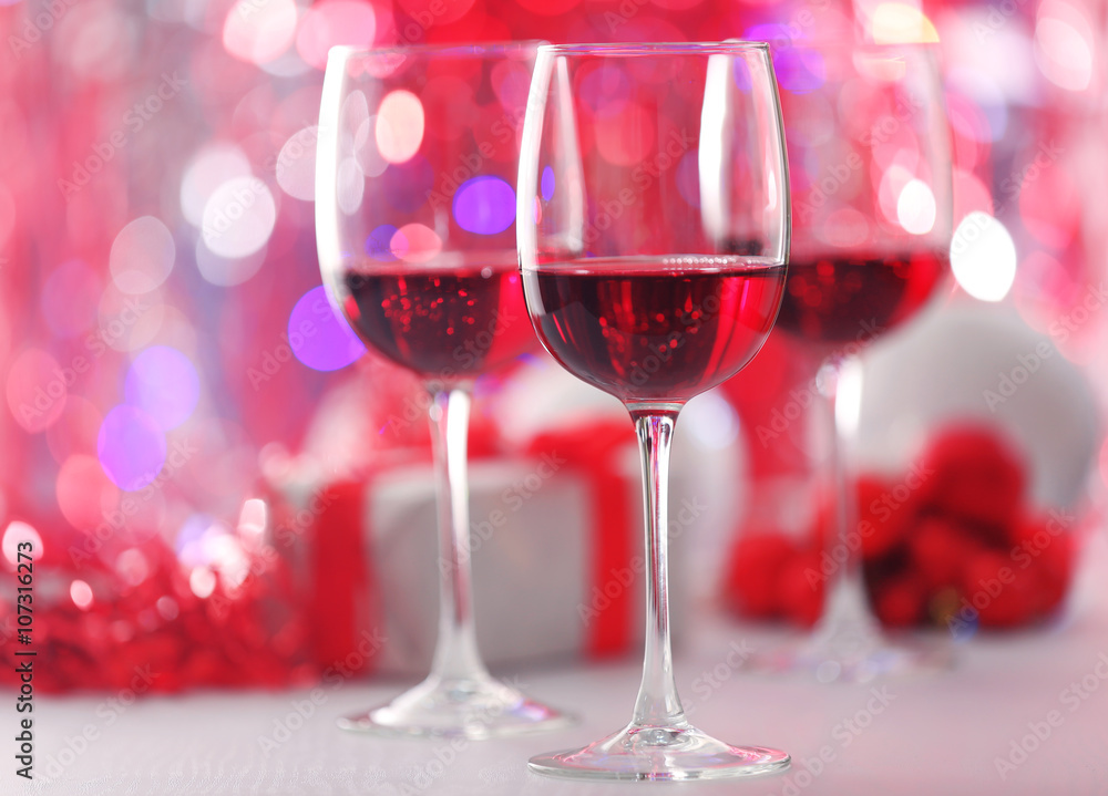 Wineglasses on red blurred lights background Wineglasses on red blurred lights background