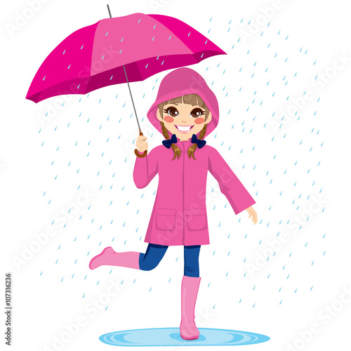 Cute little girl under the rain with pink raincoat and umbrella