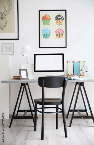 Stylish workplace with computer at home © Africa Studio