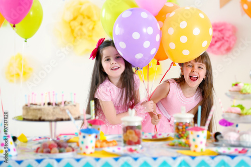 Two little girls with ballo...