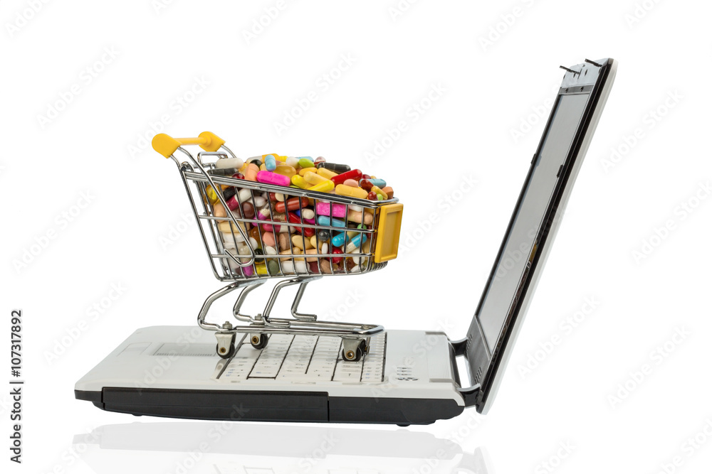 Tabletten mit Einkaufswagen und Computer