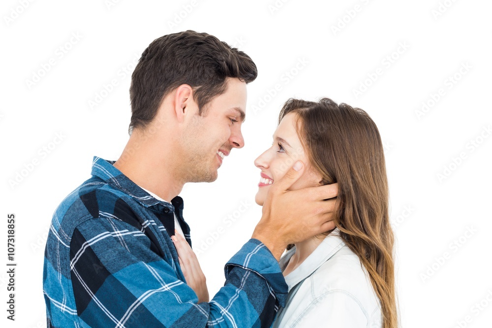 Cute couple embracing and looking to each other Cute couple embracing and looking to each other