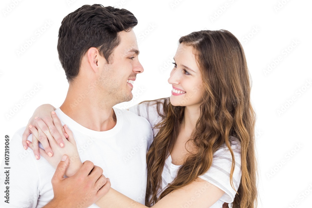 Cute couple embracing and looking to each other Cute couple embracing and looking to each other