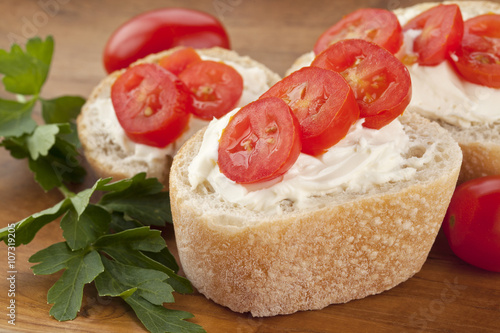 bread slices with cream and tomatoes