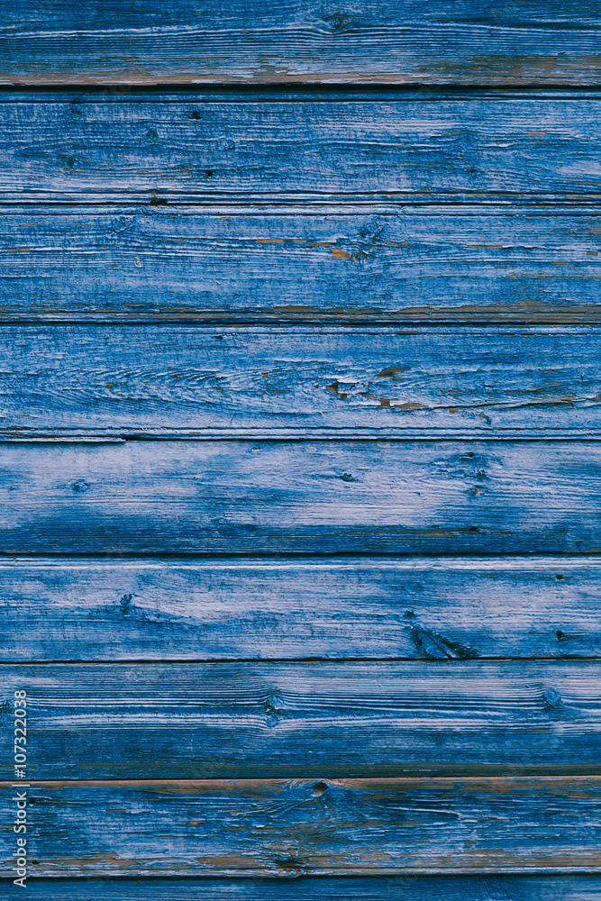 Old blue cracked paint on the old wooden background Old blue cracked paint on the old wooden background