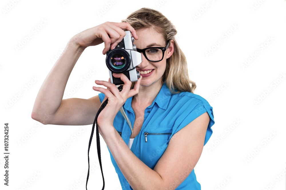 Portrait of smiling woman holding digital camera Portrait of smiling woman holding digital camera