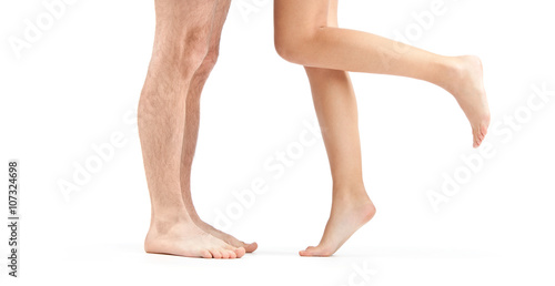 woman and man leg with foot isolated on white