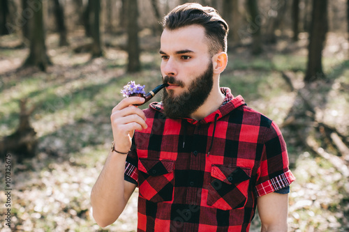 Bearded man with a pipe flowers