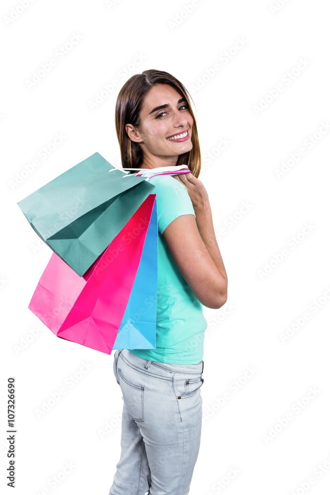 Portrait of cheerful woman holding shopping bags Portrait of cheerful woman holding shopping bags