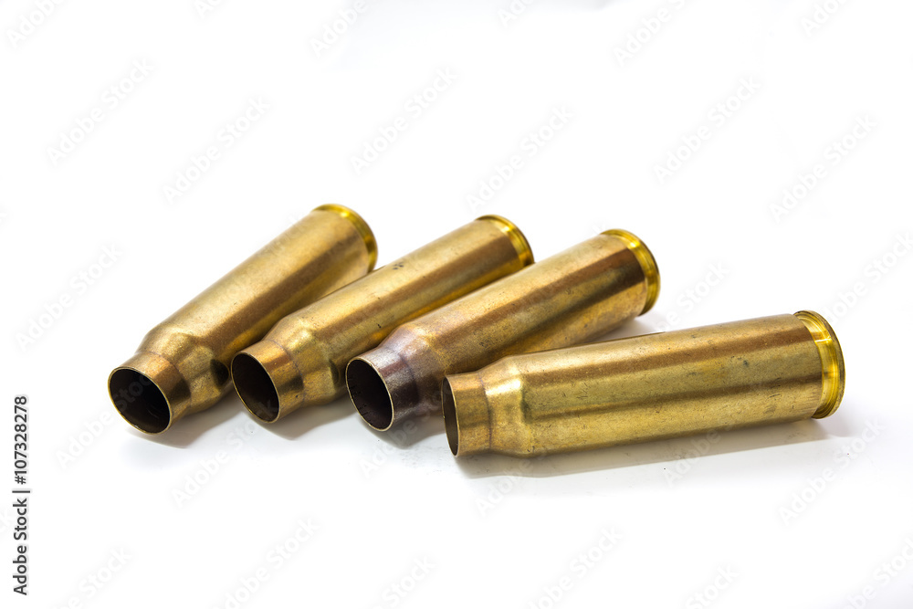 20 mm cartridges cases of aircraft cannon isolated on white back 20 mm cartridges cases of aircraft cannon isolated on white back