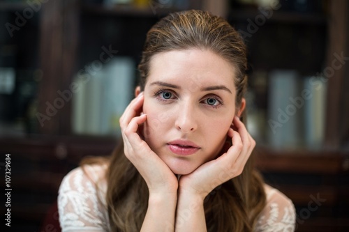 Portrait of sad woman with hand on chin