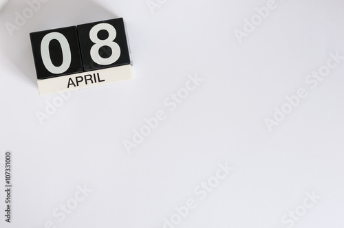 April 8th. Image of april 8 wooden countdown calendar on white background. Spring day, empty space for text. International Roma Gypsy Day