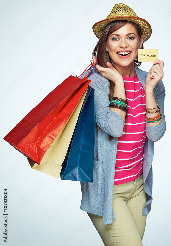Smiling woman holding credit card, portrait with shopping bag. Smiling woman holding credit card, portrait with shopping bag.
