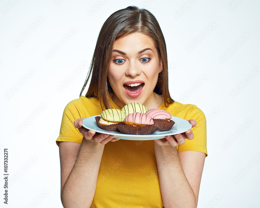 Close up face portrait of happy woman holding plate with macaro