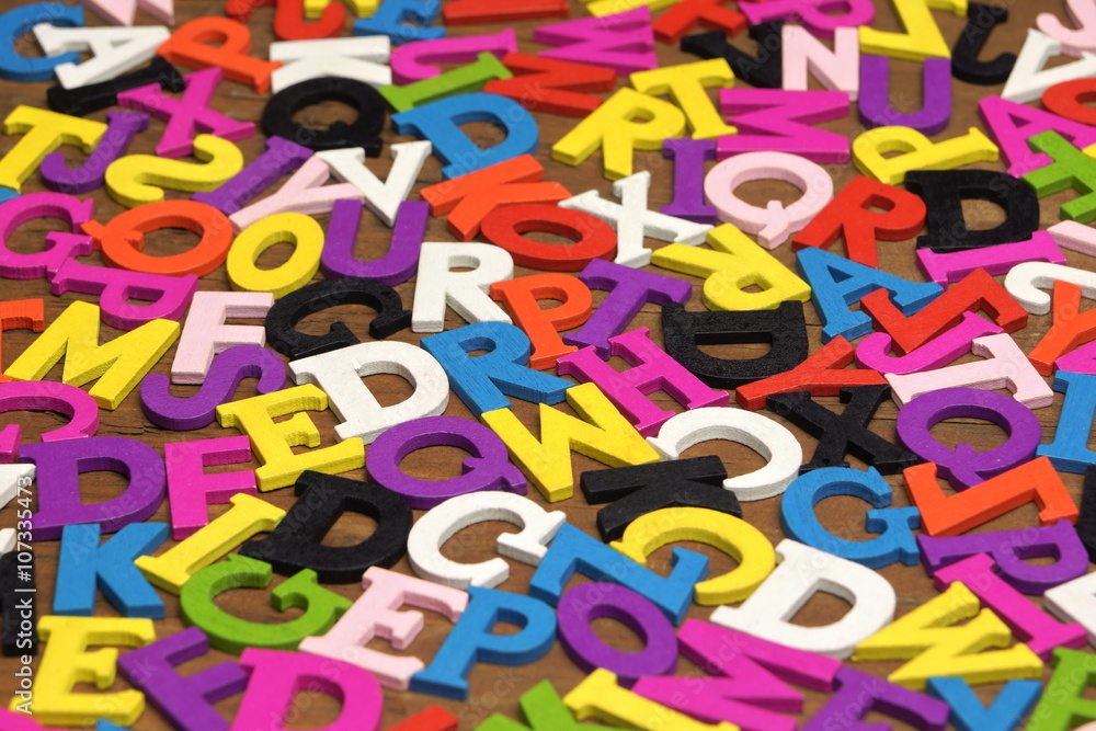 Random English Wooden Multicolored Letters On The Brown Wood Bac Random English Wooden Multicolored Letters On The Brown Wood Bac