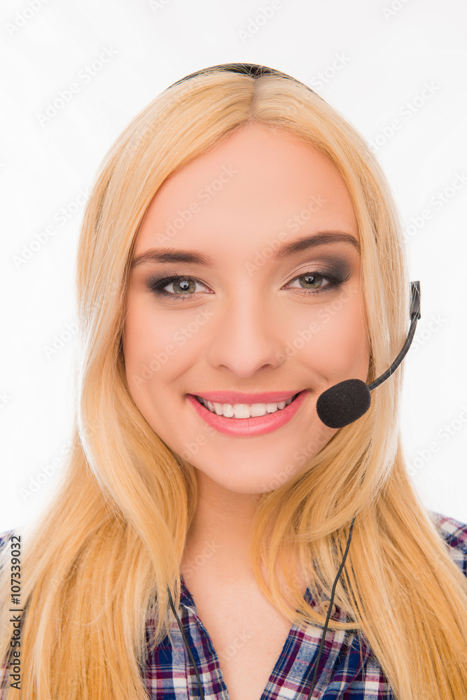 Close up portrait of cheerful pretty young blonde in headphones Close up portrait of cheerful pretty young blonde in headphones