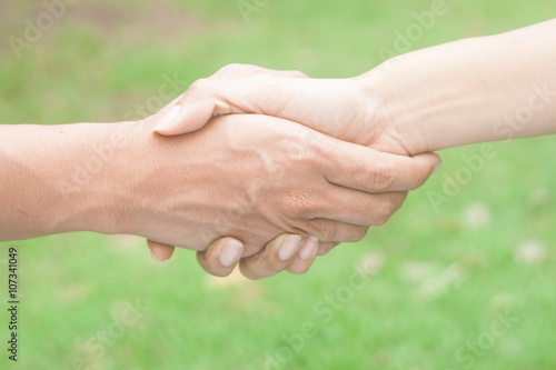 Closeup of people shaking hands © SUPREEYA-ANON