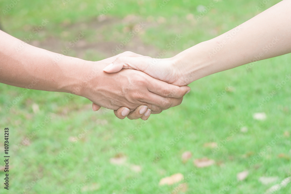 Closeup of people shaking hands Closeup of people shaking hands