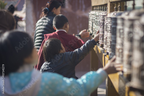 Children spining praying mills in Kathmandu, Nepal