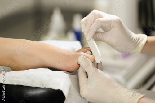 Close-up of sterile pedicure process. Manicurist works accurately and efficiently.