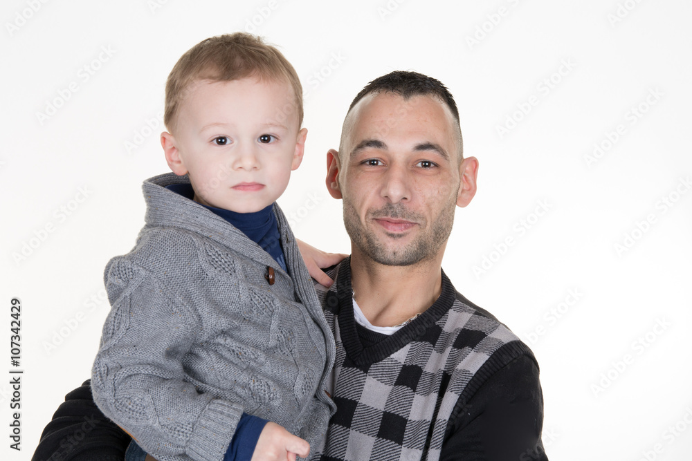 Father and son looking at the camera on white Father and son looking at the camera on white