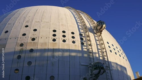 Globe arena with tourists photo