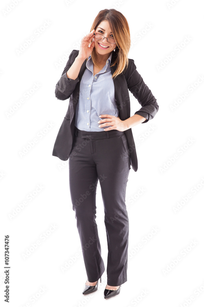 Hispanic woman wearing a suit and glasses Hispanic woman wearing a suit and glasses