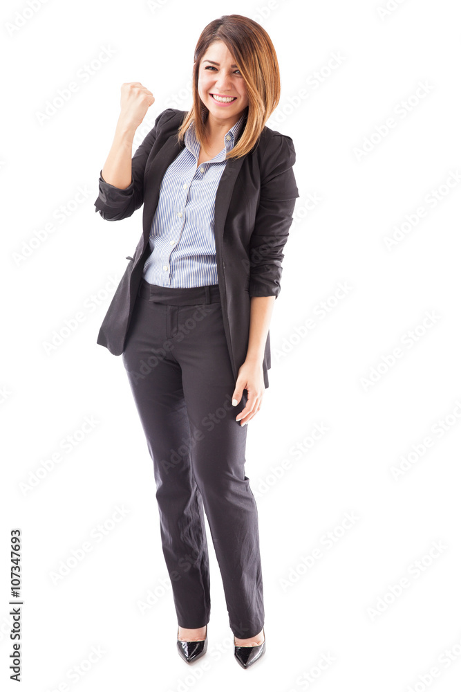 Pretty businesswoman celebrating good news Pretty businesswoman celebrating good news