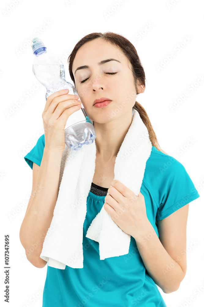 Fitness woman cooling herself with a bottle of cold water Fitness woman cooling herself with a bottle of cold water