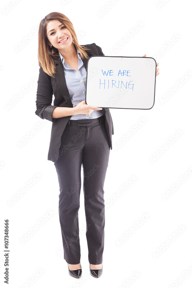 Cute female recruiter holding a sign Cute female recruiter holding a sign