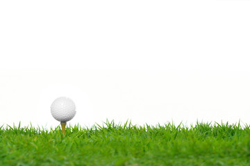 Golf ball on green grass isolated on white background
