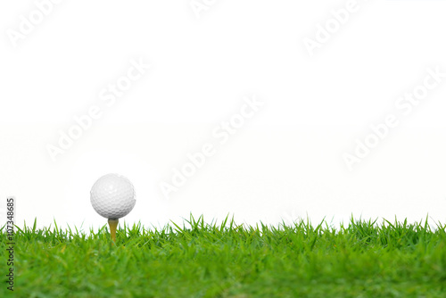 Golf ball on green grass isolated on white background 